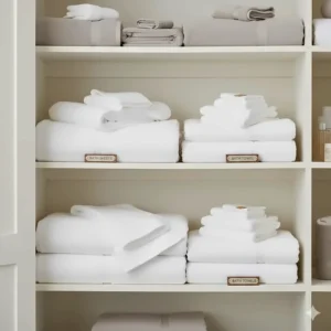 Comparison of space needed in a linen closet for folding and storing bulkier bath sheets vs bath towels.