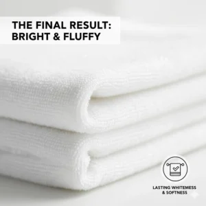 Macro shot of the clean, bright white fibers of a luxury hotel-quality bath towel after multiple washes.