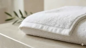 Detailed view of double-stitched hems on a premium bath towel to ensure long-lasting quality.